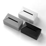 Three modern silicone tissue holders in black, gray, and white for Tesla Cybertruck car interior accessories.