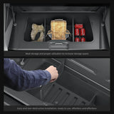 Tesla Cybertruck 2024 trunk organizer showing neat storage with boots, backpack, and soda cans for efficient packing.